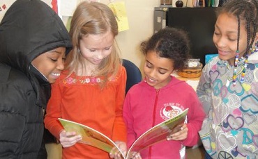 School children reading a story.